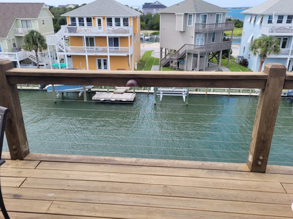 railing on deck overlooking waterway