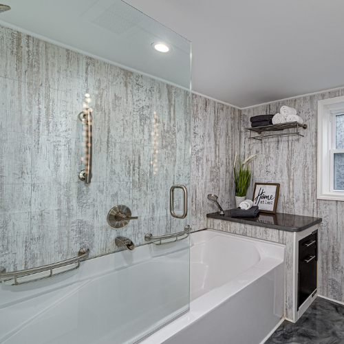 Recently completed home improvement project by Coastal Concepts Construction: A full master bathroom renovation in Wilmington, NC, featuring custom tile work and updated modern cabinetry